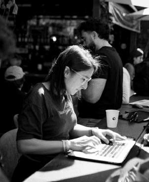 Builder working at a laptop during an event